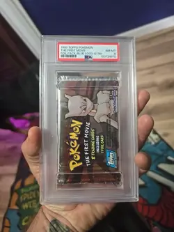 1999 TOPPS POKEMON THE FIRST MOVIE FOIL PACK FOIL PACK PSA 8 - Image 1