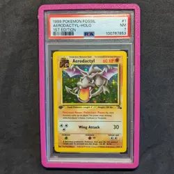 1999 POKEMON FOSSIL 1ST EDITION #1 AERODACTYL-HOLO PSA 7 - Image 1
