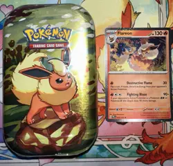 Pokemon Prismatic Evolutions Flareon Mini Tin Sealed W/ Flareon Cosmos holo card - Image 1