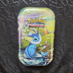 Pokemon TCG Scarlet & Violet Prismatic Evolutions Mini Tin Vaporeon 2 Packs 6+ - Image 1