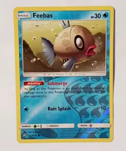 POKEMON FEEBAS REVERSE HOLO 28/70 LIGHT PLAY 2018 - Image 1