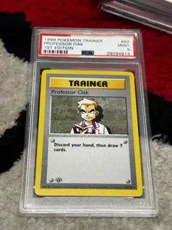 1999 POKEMON BASE SET 1ST EDITION #88 PROFESSOR OAK PSA 9 - Image 1