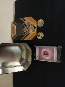 Pokemon Trading Card Game Eevee Tin with Coins & Psychic Energy Card - Image 1