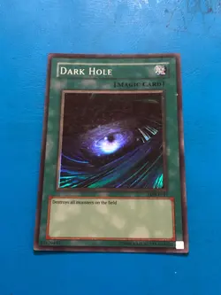YUGIOH Super Rare Dark Hole LOB-E041 PLAYED - Image 1