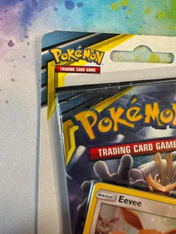 Pokemon TCG Sun & Moon Unbroken Bonds Blister Pack Eevee Holo Promo SM184 Coin - Image 3