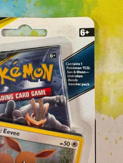Pokemon TCG Sun & Moon Unbroken Bonds Blister Pack Eevee Holo Promo SM184 Coin - Image 4