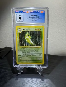 1999 Pokemon Base Set Metapod 54/102 Unlimited CGC 9 - Image 1