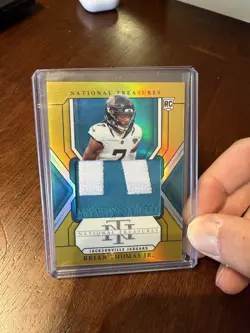 2024 Panini National Treasures Brian Thomas Jr. RC Rookie Patch GOLD /10 Bookend - Image 1