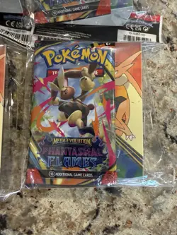 Pokemon TCG Phantasm Flames Mega Evolution Booster Pack/Mini Portfolio (SEALED) - Image 1