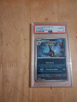 UMBREON 2023 POKEMON OBF EN 130/197 REVERSE HOLO EB GAMES STAMP PROMO PSA 10 - Image 1