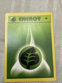 Base Set First Edition Grass Energy #99 Pokemon Card - Image 1