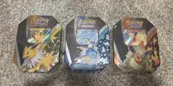 Pokemon TCG - 2021 Eevee Evolutions Tins Set Of 3 - Jolteon, Flareon, Vaporeon V - Image 1