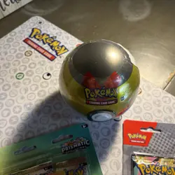 Pokemon ultra Pokeball tin d21 is from 2021 and has cosmic eclipse pack in it - Image 1