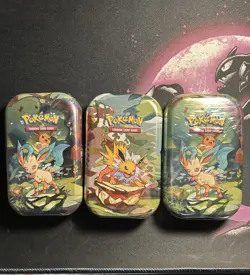 Pokemon TCG Prismatic Evolutions Mini Tins Sealed X3 Brand New In Hand - Image 1