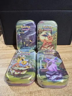 Pokemon TCG Prismatic Evolutions 4x Tins - Image 1