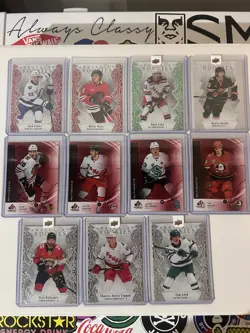 2025/26 Artifacts Redemption Rookie and SP Game Used Rookie Lot of 12 - Image 1