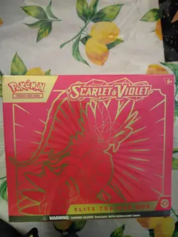 TCG: Scarlet & Violet Elite Trainer Box Miraidon Purple or Koraidon Red, Rand... - Image 1