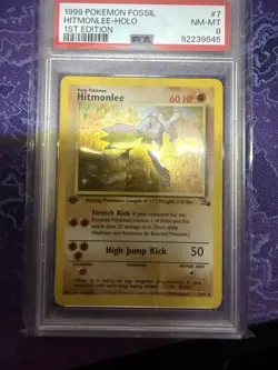 Pokemon TCG Hitmonlee 1st Edition Holo Rare Card Fossil 7/62 PSA 8 - Image 1