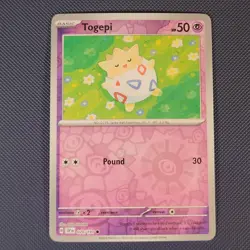 Togepi 070/191 - Surging Sparks - Common Reverse Holo Pokemon Card - NM - Image 1