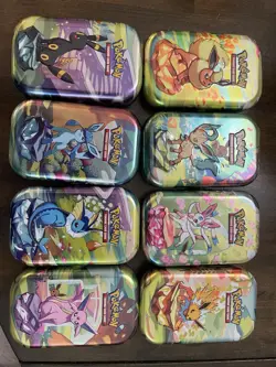 Prismatic Evolutions Empty Mini Tin Set Of 9 with Display + 9 Coins /Art Cards - Image 1