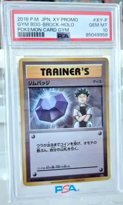 PSA 10 GEM MINT 💎 Gym Badge-Brock HOLO #XY-P 2016 XY Promo JPN Pokemon Card - Image 1