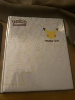 Pokemon 25th Anniversy Binder With Free Card - Image 1