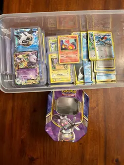 Assorted Pokemon Cards With Container| Some In Card Protectors| Regular And Holo - Image 1