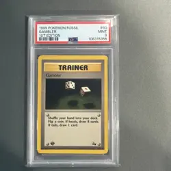 1999 POKEMON FOSSIL 1ST EDITION #60 GAMBLER PSA 9 - Image 1
