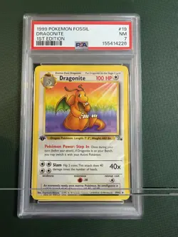 1999 POKEMON FOSSIL 1ST EDITION #19/62 DRAGONITE PSA 7 - Image 1