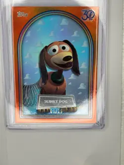 2025 Topps 30 Years of Toy Story Slinky Dog Orange Foil SP /25 - Image 1