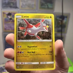 Latias SM135 Sun & Moon Black Star Promo Cosmos Holo Pokemon Card Galaxy Swirl - Image 1