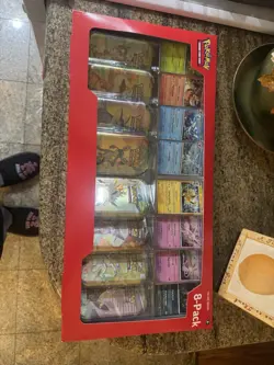 Pokemon TCG Prismatic Evolutions 8 Mini-Tins with Promo Cards, Costco - Image 1