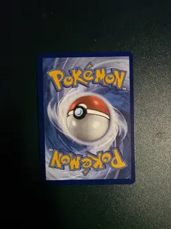 Team Rocket’s Tyranitar 096/182 Promo Pokemon TCG Card Center Stamp Sealed - Image 2