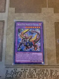 YUGIOH BRAVE-EYES PENDULUM DRAGON RATE-EN039 SECRET UNLIMITED ED NM - Image 1