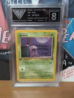 Grimer 1st Edition 48/62 Fossil 1999 Pokemon Card - GetGraded 8 Near Mint - Image 1