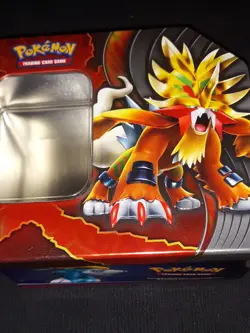 Pokemon tins as art. Mixed lot with a few cards and coins. FREE comic book. - Image 1