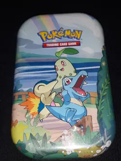 Pokemon tins as art. Mixed lot with a few cards and coins. FREE comic book. - Image 3
