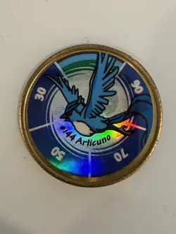 1999 Nintendo Hasbro Pokemon Battling Coin #144 ARTICUNO - Image 1