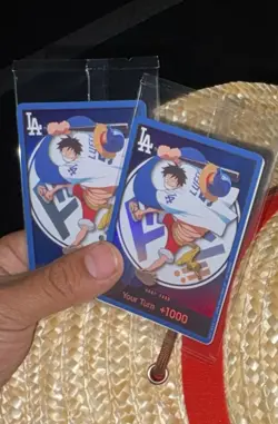 (1)2026 Dodgers x One Piece Night Promo Card & Straw Hat Monkey D Luffy In hand - Image 1