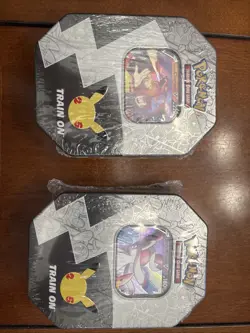 Pokemon Celebrations Tins (2) - Lance's Charizard V & Dark Sylveon V (New) - Image 1