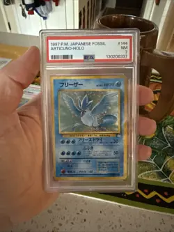 1997 Pokemon Japanese Fossil Articuno #144 Holo NM/Mint PSA 7 - Image 1
