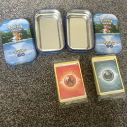 Pokemon Trading Cards in tin x2 unopened packaging. Full of energy cards - Image 1