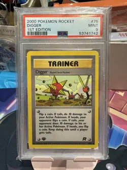 PSA 9 Pokemon 2000 Team Rocket 1st Edition Digger Trainer #75 - Image 1