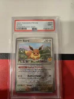 2025 POKEMON PRE EN-PRISMATIC EVOLUTIONS POKEMON DAY 2025 #074 EEVEE PSA 9 MINT - Image 1