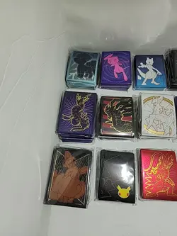 Lot of 29 Assorted Pokemon Sealed ETB Card Sleeves - Image 2