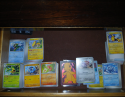 Pokemon Company Pokemon TCG Mixed Card Lot Holo w/ Tins & Boxes Surging Sparks - Image 1