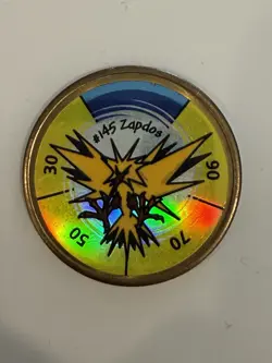 1999 Nintendo Hasbro Pokemon Battling Coin #145 ZAPDOS - Image 1