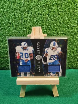 2024 Panini Illusions - Deja Vu Barry Sanders, Jahmyr Gibbs #DV-DET /199 (MEM) - Image 1