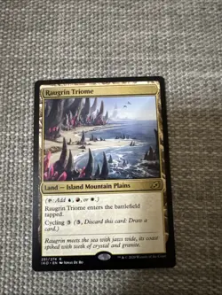Raugrin Triome Ikoria: Lair of Behemoths Regular Card, Near Mint Condition - Image 1