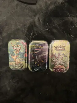 3x Pokemon Prismatic Evolutions mini tins Umbreon, Leafeon, Sylveon - Image 1